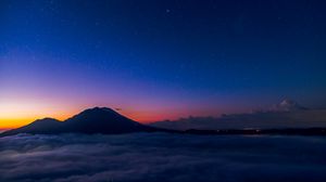 Preview wallpaper starry sky, mountains, clouds, night