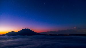 Preview wallpaper starry sky, mountains, clouds, night