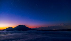 Preview wallpaper starry sky, mountains, clouds, night