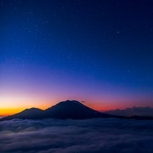 Preview wallpaper starry sky, mountains, clouds, night