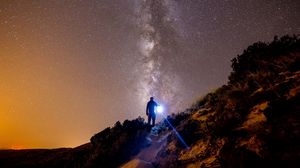 Preview wallpaper starry sky, mountains, man, light