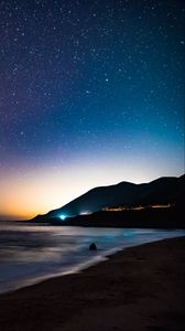 Preview wallpaper starry sky, mountains, night, sea, stars, shore