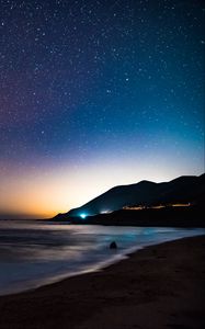 Preview wallpaper starry sky, mountains, night, sea, stars, shore