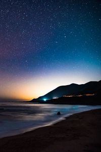 Preview wallpaper starry sky, mountains, night, sea, stars, shore