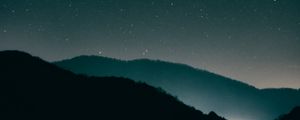 Preview wallpaper starry sky, mountains, night, radiance