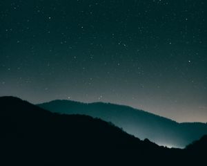 Preview wallpaper starry sky, mountains, night, radiance