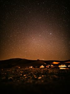 Preview wallpaper starry sky, night, buildings, hills, dark