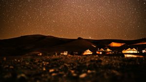 Preview wallpaper starry sky, night, buildings, hills, dark