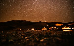 Preview wallpaper starry sky, night, buildings, hills, dark