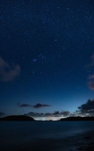 Preview wallpaper starry sky, night, horizon, island, stars, shine