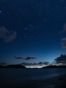 Preview wallpaper starry sky, night, horizon, island, stars, shine