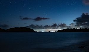 Preview wallpaper starry sky, night, horizon, island, stars, shine