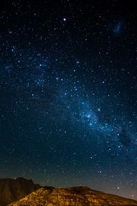 Preview wallpaper starry sky, night, mountains, radiance, glitter
