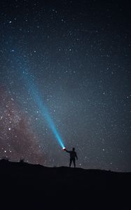 Preview wallpaper starry sky, night, silhouette, light, flashlight