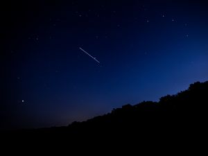 Preview wallpaper starry sky, night, stars, fall, trees, darkness