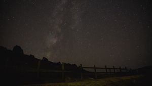 Preview wallpaper starry sky, night, trees, hedge