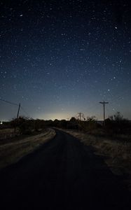 Preview wallpaper starry sky, night, turn, road, marking