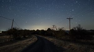 Preview wallpaper starry sky, night, turn, road, marking