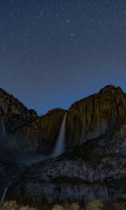 Preview wallpaper starry sky, precipice, waterfall