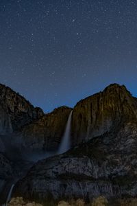 Preview wallpaper starry sky, precipice, waterfall