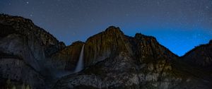 Preview wallpaper starry sky, precipice, waterfall