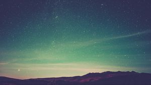 Preview wallpaper starry sky, radiance, mountains, sky
