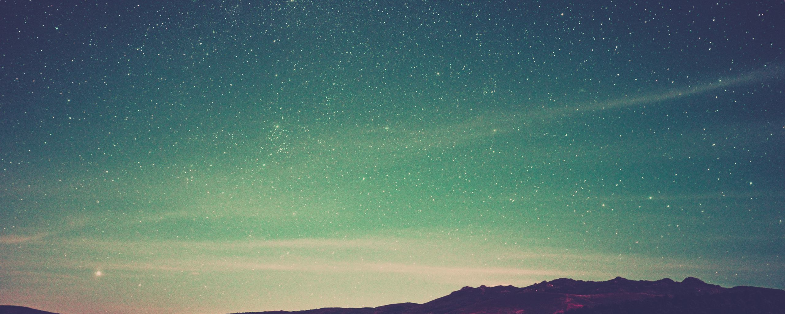 Download wallpaper 2560x1024 starry sky, radiance, mountains, sky