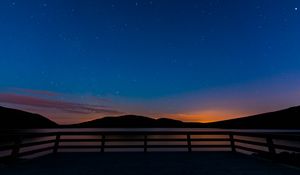 Preview wallpaper starry sky, railing, stars, mountains