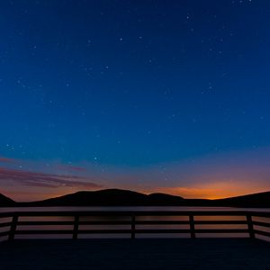 Preview wallpaper starry sky, railing, stars, mountains