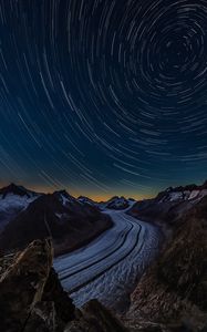 Preview wallpaper starry sky, road, rocks, twisting