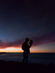 Preview wallpaper starry sky, silhouette, alone, solitude, hat, horizon