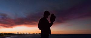 Preview wallpaper starry sky, silhouette, alone, solitude, hat, horizon