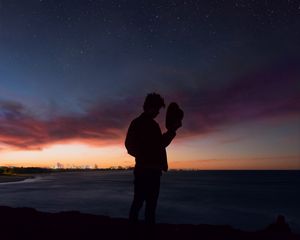 Preview wallpaper starry sky, silhouette, alone, solitude, hat, horizon