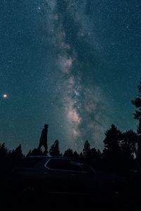 Preview wallpaper starry sky, silhouette, milky way, car, trees, night