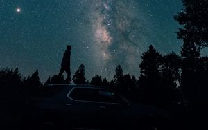 Preview wallpaper starry sky, silhouette, milky way, car, trees, night