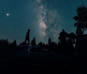 Preview wallpaper starry sky, silhouette, milky way, car, trees, night