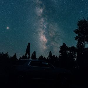 Preview wallpaper starry sky, silhouette, milky way, car, trees, night