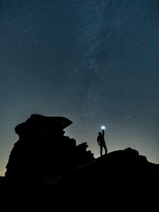 Preview wallpaper starry sky, silhouette, spectral, rocks