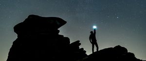 Preview wallpaper starry sky, silhouette, spectral, rocks