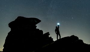 Preview wallpaper starry sky, silhouette, spectral, rocks