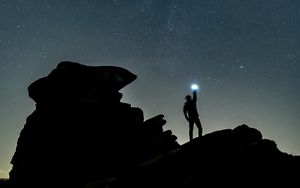 Preview wallpaper starry sky, silhouette, spectral, rocks