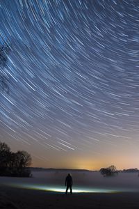 Preview wallpaper starry sky, silhouette, winter, solitude, mist, trees