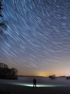 Preview wallpaper starry sky, silhouette, winter, solitude, mist, trees