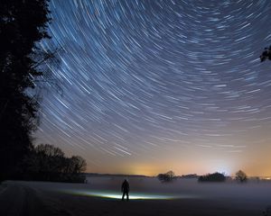 Preview wallpaper starry sky, silhouette, winter, solitude, mist, trees