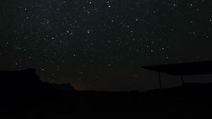 Preview wallpaper starry sky, sky, night, stars, silhouette, building