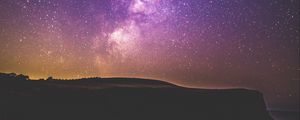 Preview wallpaper starry sky, stars, night, purple, hill, grass