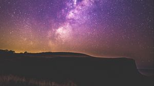 Preview wallpaper starry sky, stars, night, purple, hill, grass