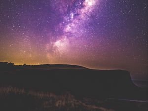 Preview wallpaper starry sky, stars, night, purple, hill, grass