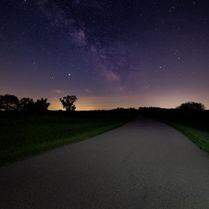 Preview wallpaper starry sky, stars, road, bushes, night