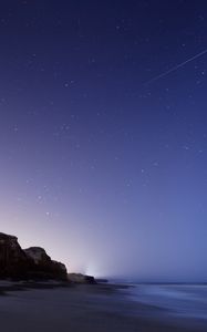 Preview wallpaper stars, night, twilight, the sky, falling, the sea, the rock